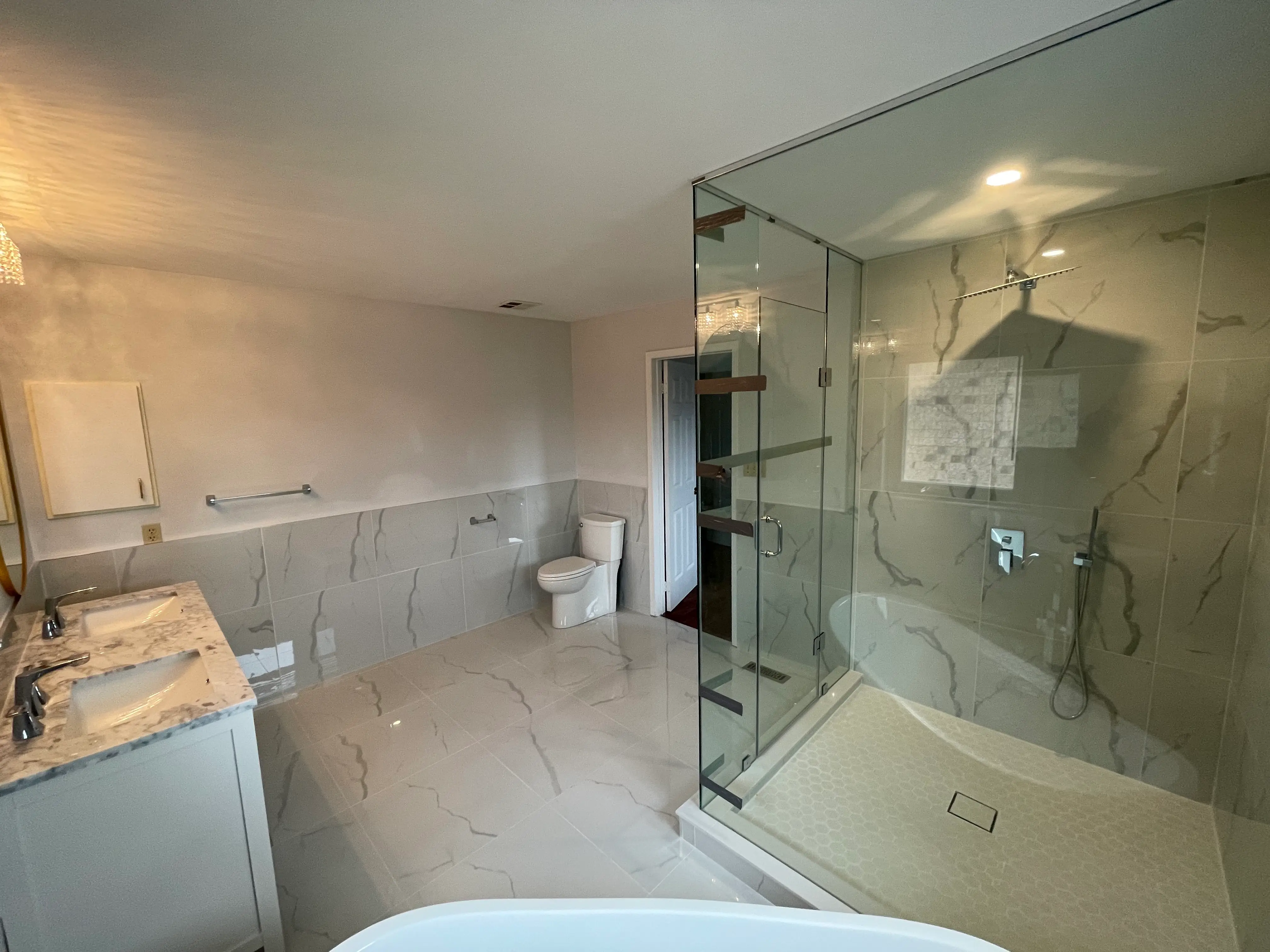 Bathroom renovation with glass shower and heated tile floor