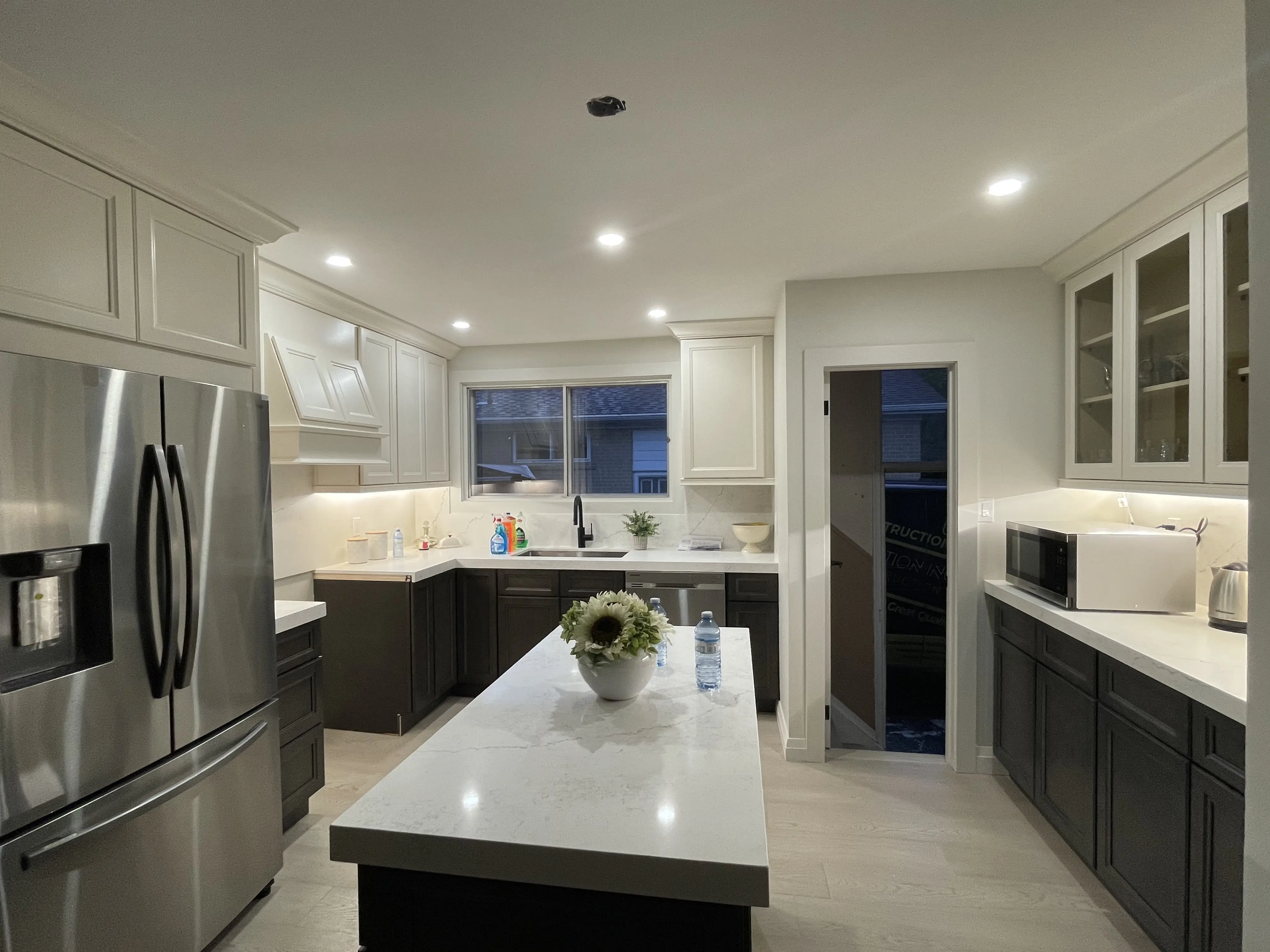 Custom kitchen renovation with shaker cabinets and quartz countertops